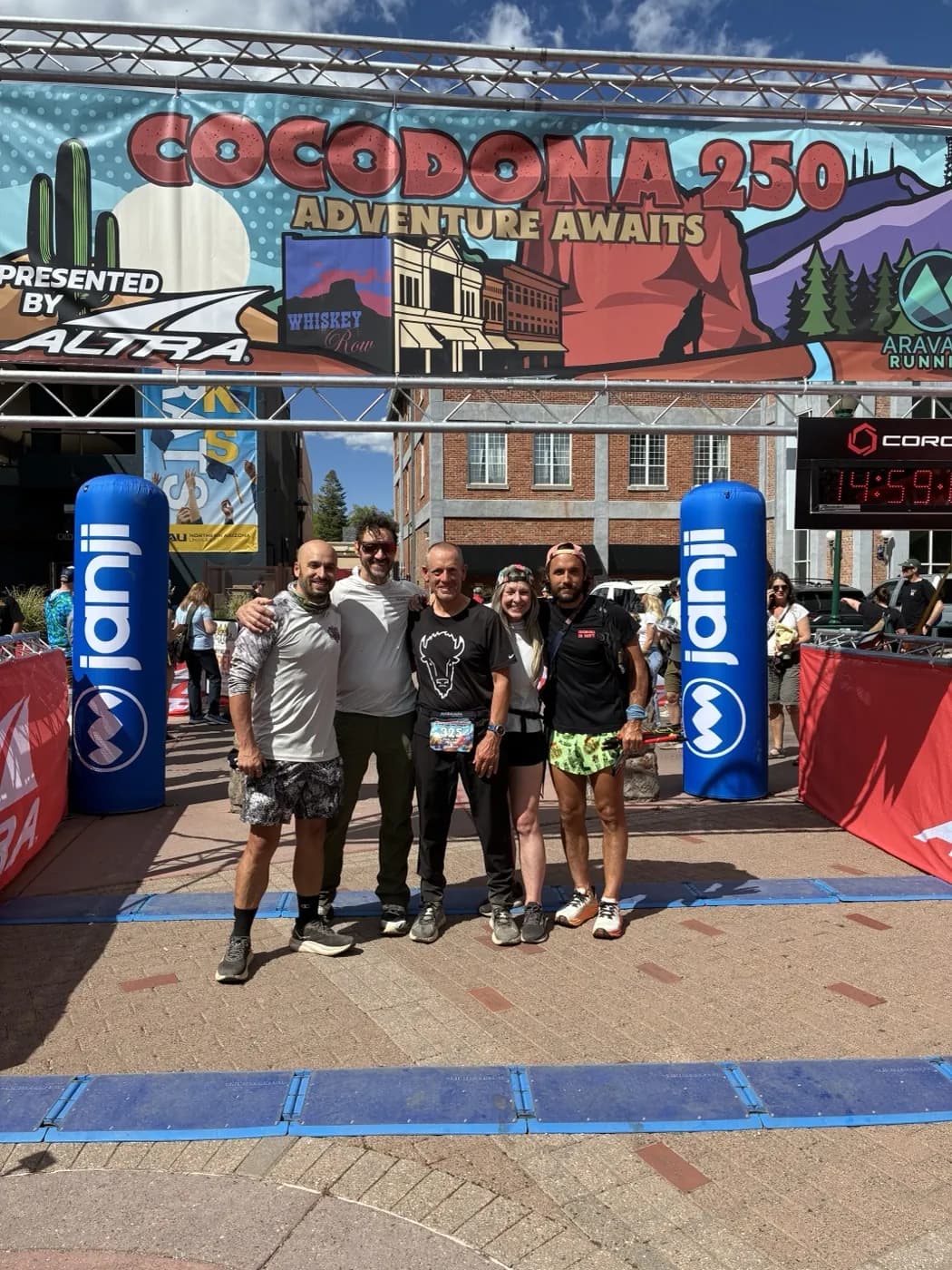 Family and friends at the Cocodona 250 finish line, with Paul James Johnson in the center